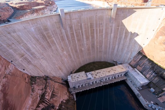Glen Canyon Dam with Lake Powell in the Desert rural area of Page city Arizona, United States. USA Landmark environmental water resources reservoir and electricity concept.