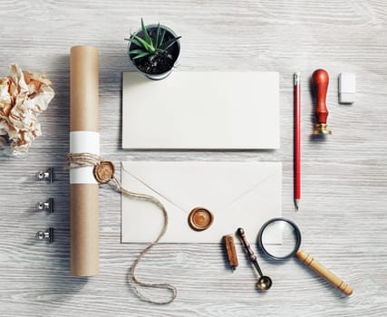 Photo of blank retro stationery set on light wooden background. Template for branding identity. Responsive design mockup. Top view. Flat lay.