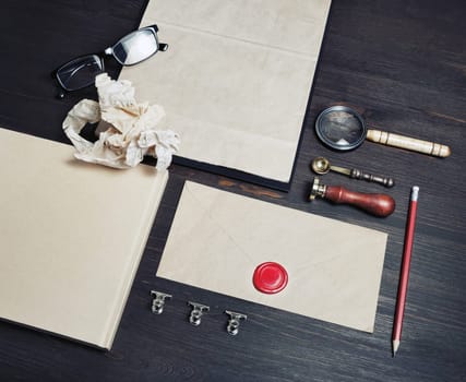 Old blank retro stationery on wooden background.