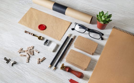 Blank business stationery set on light wooden background. Vintage corporate identity template. Branding mock-up.