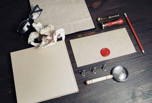 Blank retro stationery set on wood table background. Corporate branding stationery template.