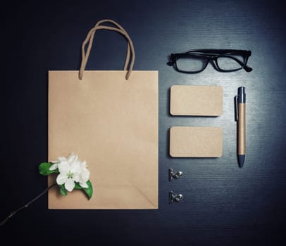 Blank retro stationery set on black wooden background. Template for graphic designers portfolios. Flat lay.