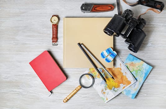 Vintage tourist devices. Traveler's accessories. Planning vacation. Top view. Flat lay.