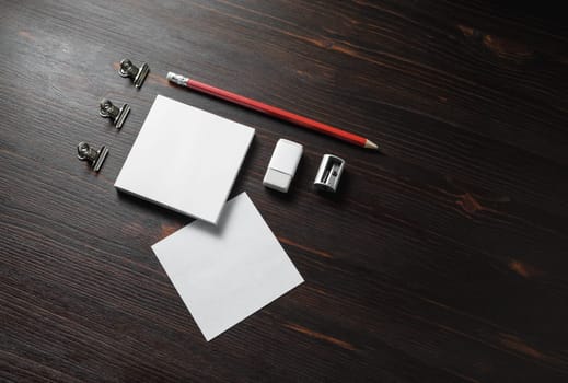 Corporate identity template. Blank stationery mock up on wooden background. Notes, pencil, eraser and sharpener.