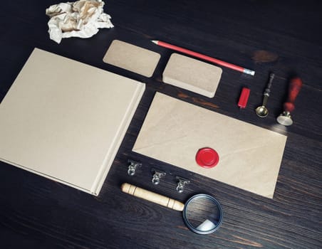 Photo of blank vintage stationery set on wooden background. Corporate identity mock up for placing your design.