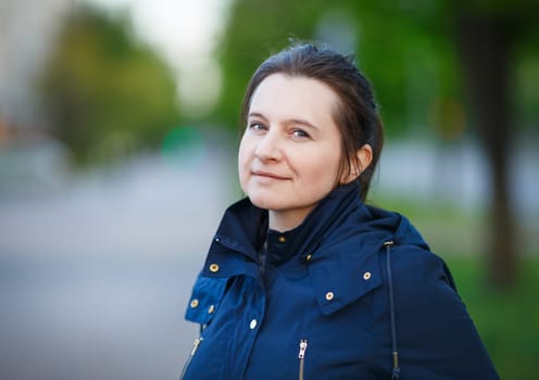 Portrait of a woman outdoors. Shallow depth of field. Selective focus.