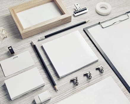 Business stationery mock-up. Blank corporate identity template on light wood table background.