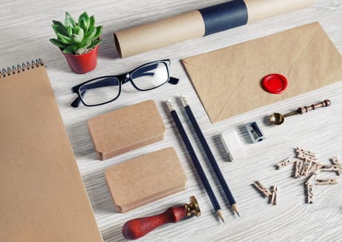 Blank stationery set on light wood table background. Vintage template for branding identity. For graphic designers presentations and portfolios.
