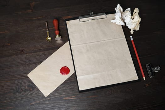 Branding mock up. Photo of blank vintage stationery on wood table background.