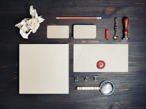 Blank retro stationery template on wooden background. Mock-up for branding identity. For design presentations and portfolios. Flat lay.