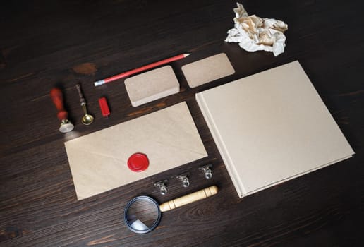 Corporate identity mockup. Blank kraft paper stationery set on wood table background. Responsive design template.