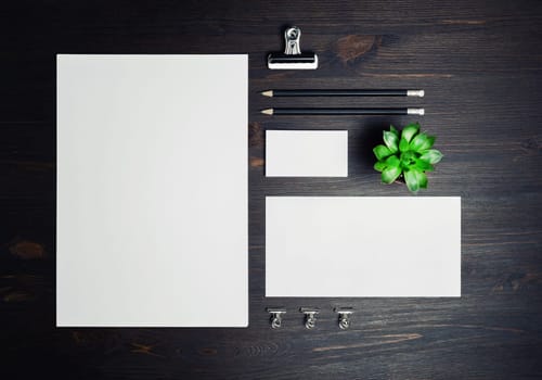 Stationery mock up on wooden background. Responsive design template. Branding identity mock up. Top view. Flat lay.