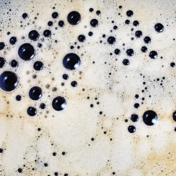 Photo of coffee with bubbles. Close-up coffee foam texture. Flat lay.
