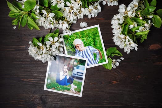 Two square photos with spring flowers on wood table background. Flat lay.