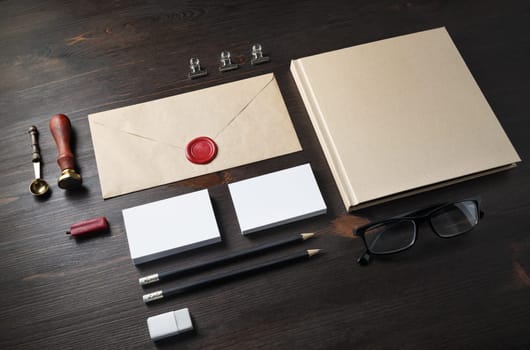 Blank kraft corporate identity template on wooden background. Responsive design mockup.