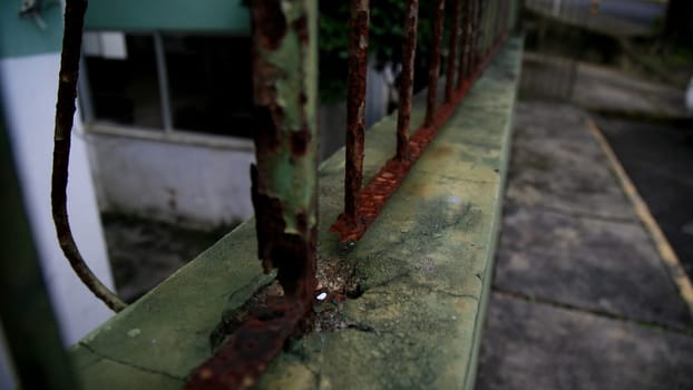 salvador, bahia / brazil - july 4, 2020: rusty grid is seen on the street in the Cabula neighborhood in the city of Salvador.......