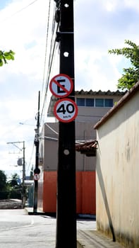 salvador, bahia / brazil - july 4, 2020: road signs indicate a maximum speed of 40 kilometers per hour and prohibited from parking are seen in the city of Salvador.