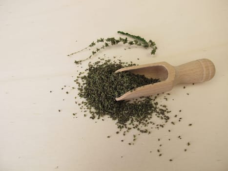 Dried nettle seeds superfood on a wooden board