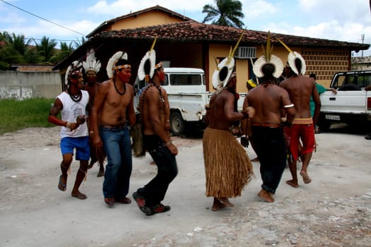 porto Seguro, bahia / brazil - february 27, 2008: Pataxo Indians are seen doing a typical dance, during a protest in search of improvements in the health system of their village in the city of Porto Seguro.