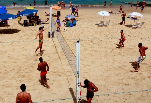 eunapolis, bahia / brazil - october 26, 2014: people are seen watching football on the beach at Porto da Barra in the city of Salvador.