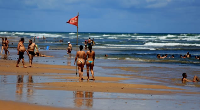 salvador, bahia / brazil - december 22, 2015: women are seen in bikinis on Stella Mares beach in the city of Salvador.