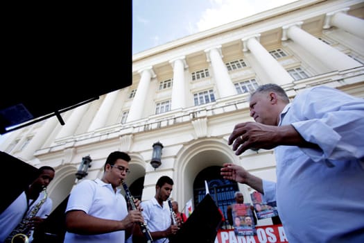salvador, bahia / brazil - june 28, 2019: Fred Dantas, conductor is seen conducting an orchestra on the street in the city of Salvador.