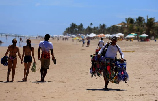 salvador, bahia / brazil - december 30, 2015: Street vendor is seen at Praia do Flamengo in the city of Salvador.
