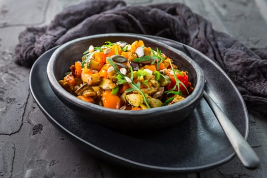 Low carb salad of grilled vegetables with rocket (arugula) and seeds