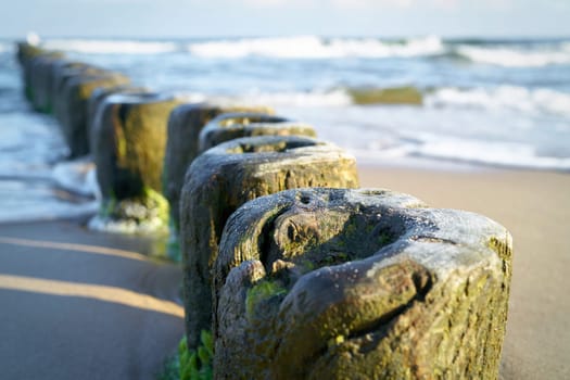 Breakwater on the beach of the Baltic Sea near Rewal in Poland