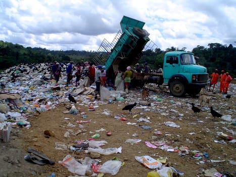 itabuna, bahia / brazil - september 22, 2011: collectors of material for recycling are seen collecting material at the sanitary landfill in the city of Itabuna.