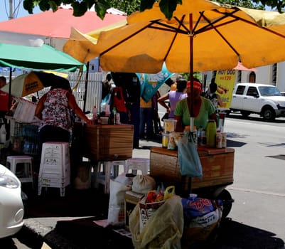 salvador, bahia / brazil - december 14, 2012: Street vendors of snacks on the sidewalk of the Pituba neighborhood in the city of Salvador.