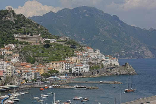 Amalfi, Italy - June 27, 2014: Picturesque Small Seaside Town at Cliffs Summer Day in Amalfi, Italy.