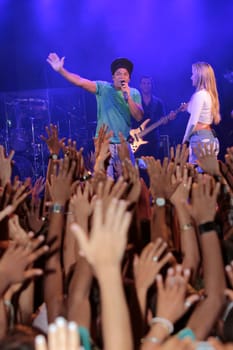 salvador, bahia / brazil - december 12, 2012: Claudia Leitte, singer is seen alongside singer Carlinhos Brown during a performance in the city of Salvador.