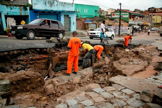 eunapolis, bahia / brazil - june 3, 2009: workers are seen recovering runway destroyed by rain that fell in the city of Eunapolis.