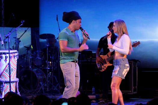 salvador, bahia / brazil - december 12, 2012: Claudia Leitte, singer is seen alongside singer Carlinhos Brown during a performance in the city of Salvador.