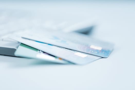 Bank creadit cards on keyboard. Concept of online banking and internet purchase. Soft focus.