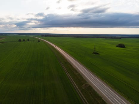 Top view of the road in summer evening. View from drone