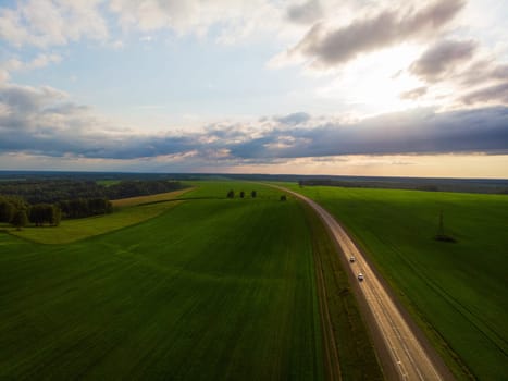 Top view of the road in summer evening. View from drone