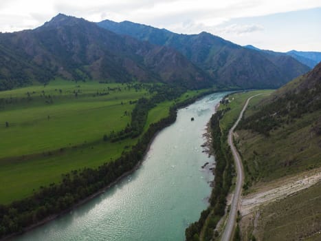 Aerial view of Katun river, in Altai mountains, in beauty summer evening, drone shot