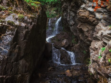 Waterfall Cheremshansky in Altai Mountains territory, West Siberia, Russia