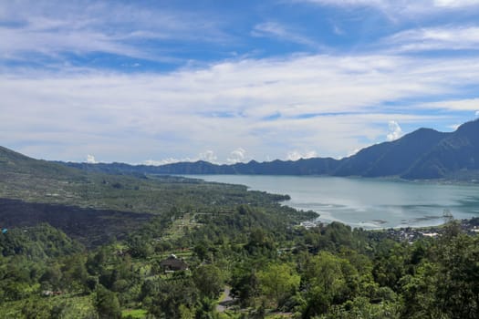 Panoramic indonesian landscape tropical island bali. Popular tourist attractions of Bali tropical island, amazing top view on Batur Indonesia. Batur lake and volcano are in the central mountains.
