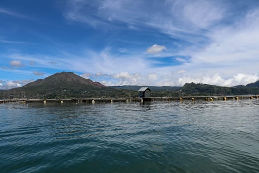 Batur volcano on Bali island, Indonesia. Active Indonesian Volcano Batur in the tropical island. Batur lake and volcano are in the central mountains of Bali near the Kintamani village, Indonesia.