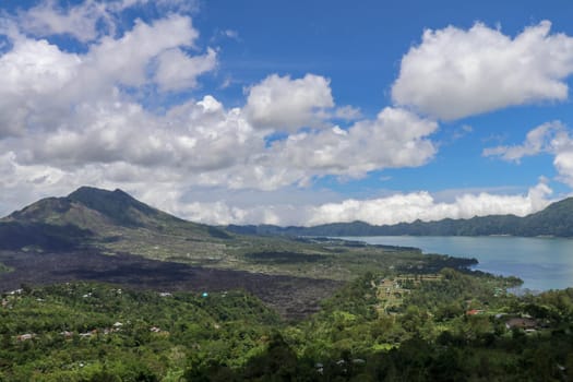 Panoramic indonesian landscape tropical island bali. Popular tourist attractions of Bali tropical island, amazing top view on Batur Indonesia. Batur lake and volcano are in the central mountains.