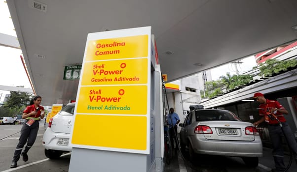 salvador, bahia / brazil - august 7, 2019: Gas station attendant making fuel supply in vehicle at gas station.
