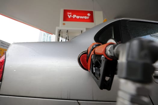 salvador, bahia / brazil - august 7, 2019: Gas station attendant making fuel supply in vehicle at gas station.