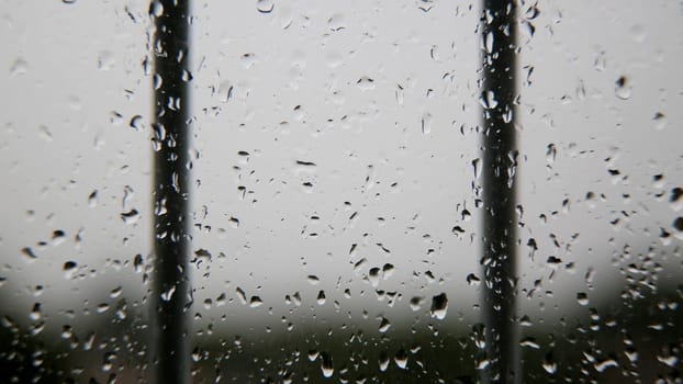 salvador, bahia / brazil - july 7, 2020: raindrops of water are seen coming down from an apartment window in the city of Salvador.