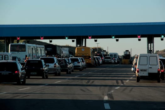 salvador, bahia / brazil - december 19, 2012: vehicles are seen in a toll plaza on highway BA 526, Cia / Aeroporto, in the city of Salvador.