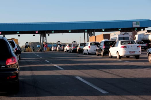 salvador, bahia / brazil - december 19, 2012: vehicles are seen in a toll plaza on highway BA 526, Cia / Aeroporto, in the city of Salvador.