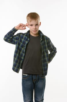 boy put his index finger to the temple on a white background
