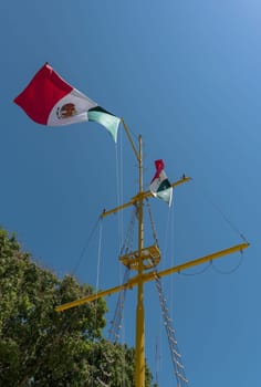 Mexican flag on a sailing mast in Chetumal, Mexico